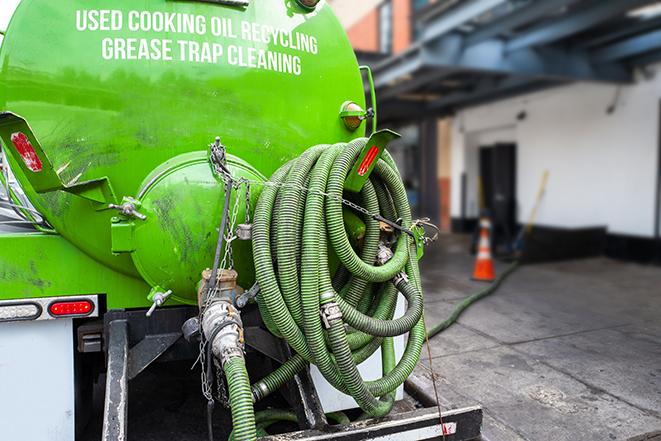 pumping out a heavy-duty grease trap at a restaurant in Cannon Ball